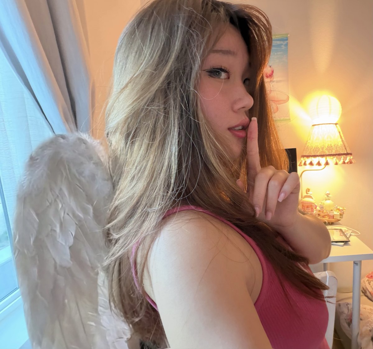 Elise, the witch behind Seraphiette, wearing angel wings